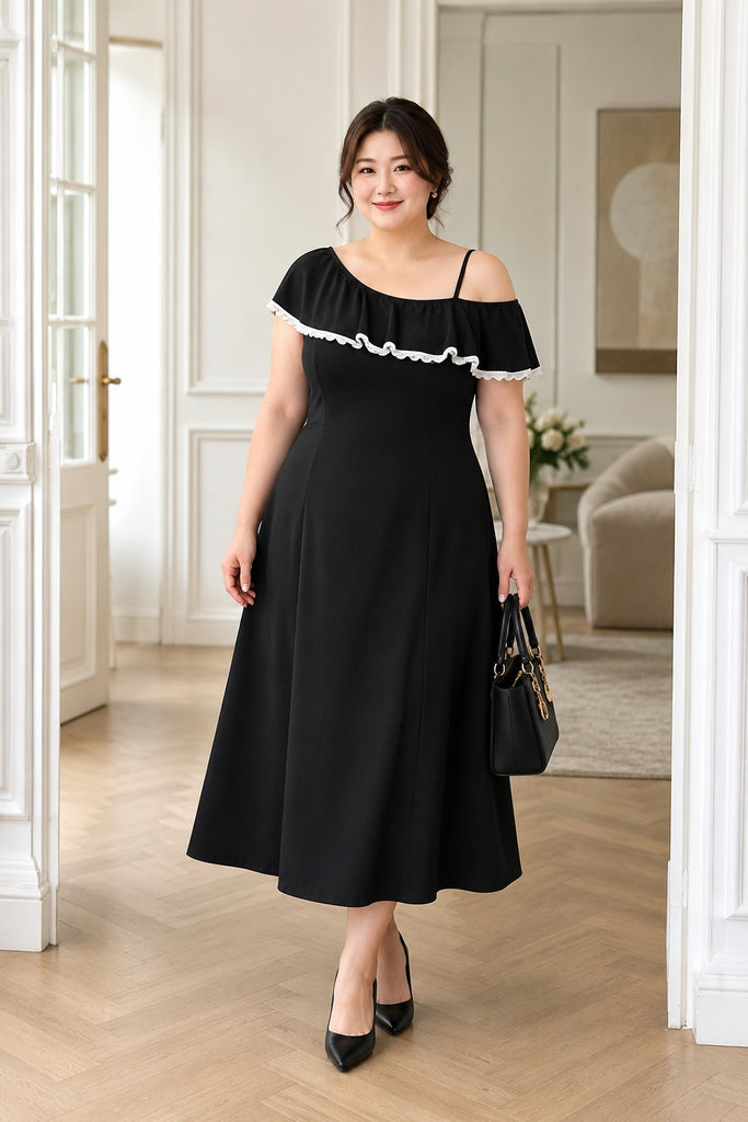 Plus size black asymmetric cold shoulder midi dress worn by model