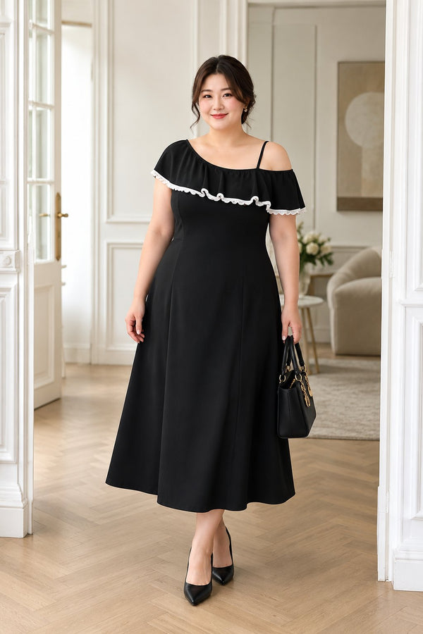 Plus size black asymmetric cold shoulder midi dress worn by model