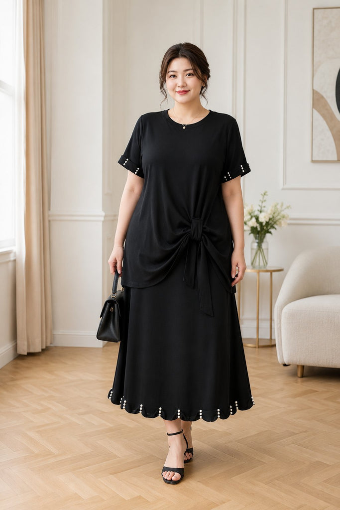 Plus size black side tie tunic tee and midi skirt set worn by model