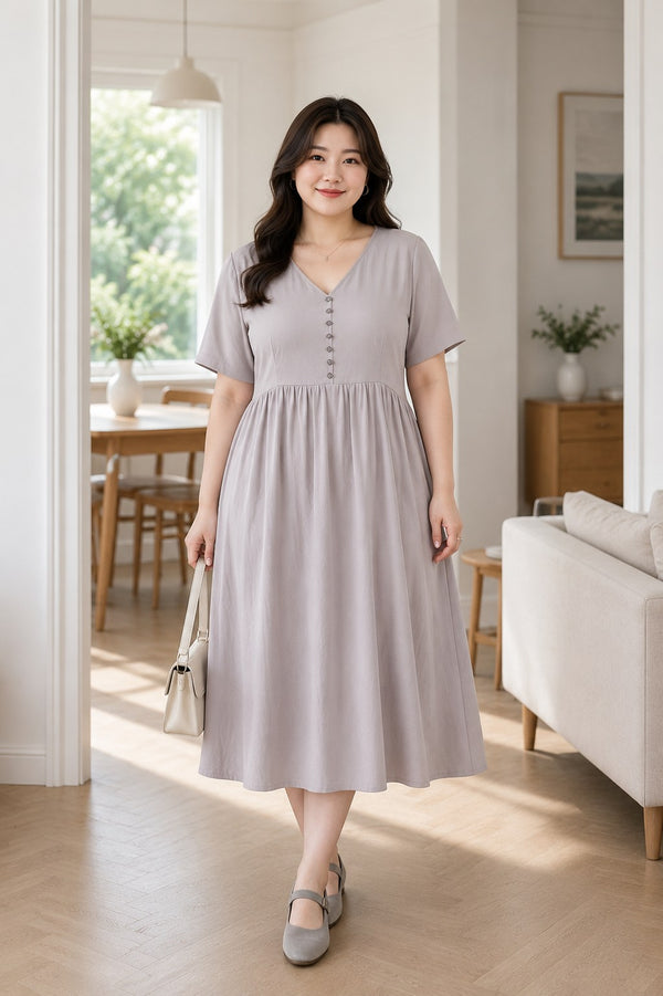 Plus size grey Henley button babydoll midi dress front view on model