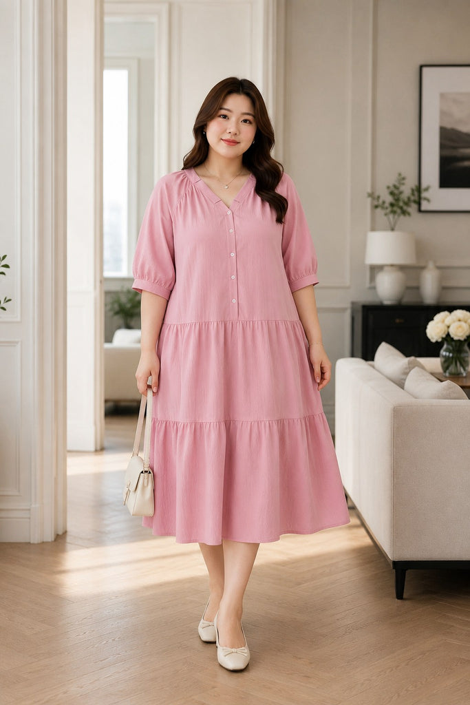 Plus size light pink V-neck Henley tiered midi dress front view on model