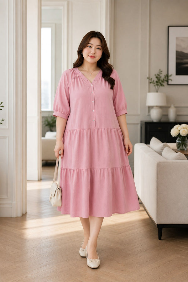 Plus size light pink V-neck Henley tiered midi dress front view on model
